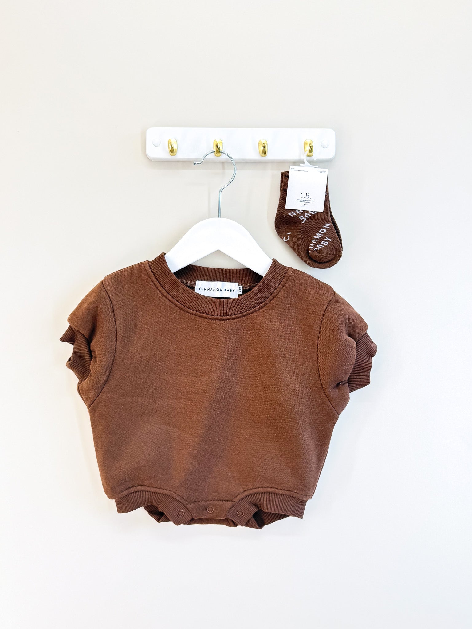 Cinnamon Baby logo romper + socks (0-3m)