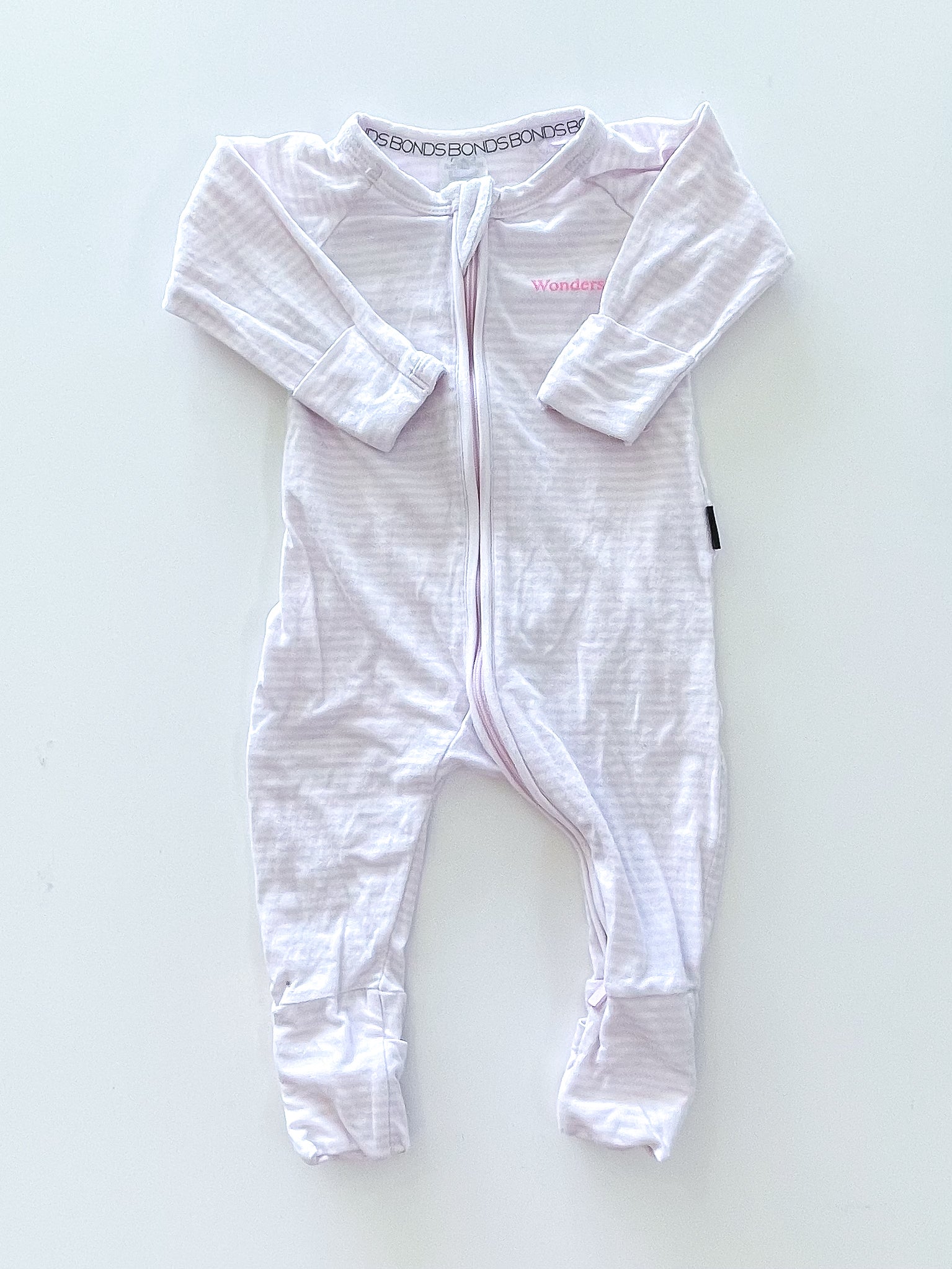 Bonds wondersuit - pink stripe (0-3m)
