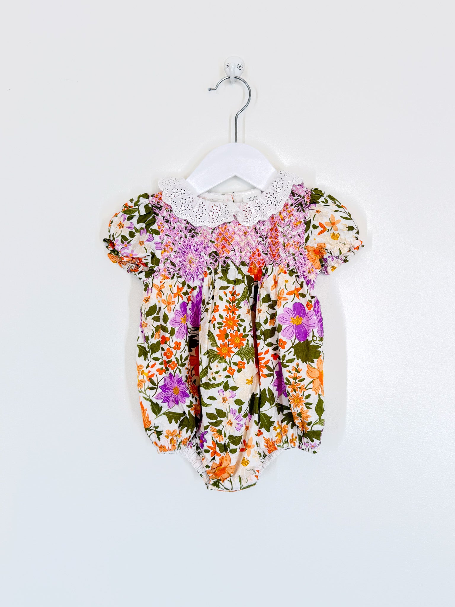 Next floral smocked collared romper (6-9m)