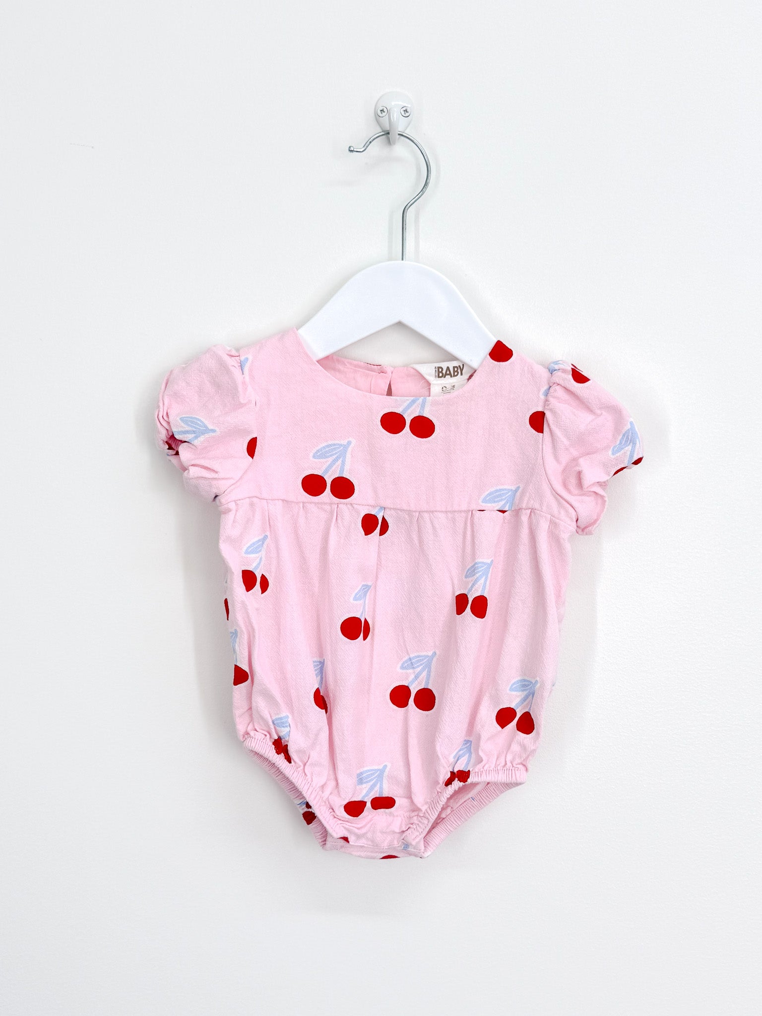 Cotton On Kids cherry romper (0-3m)