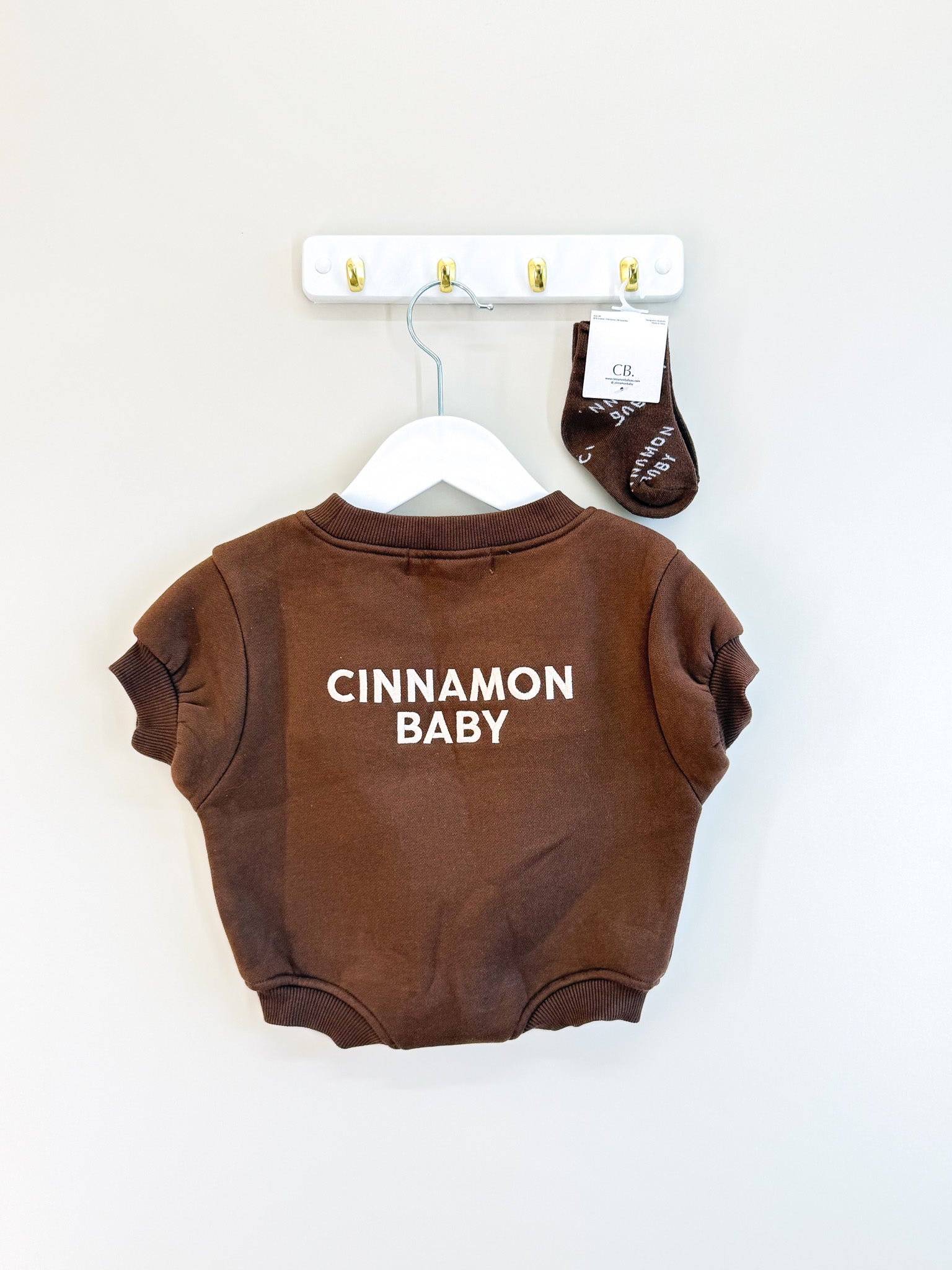 Cinnamon Baby logo romper + socks (0-3m)