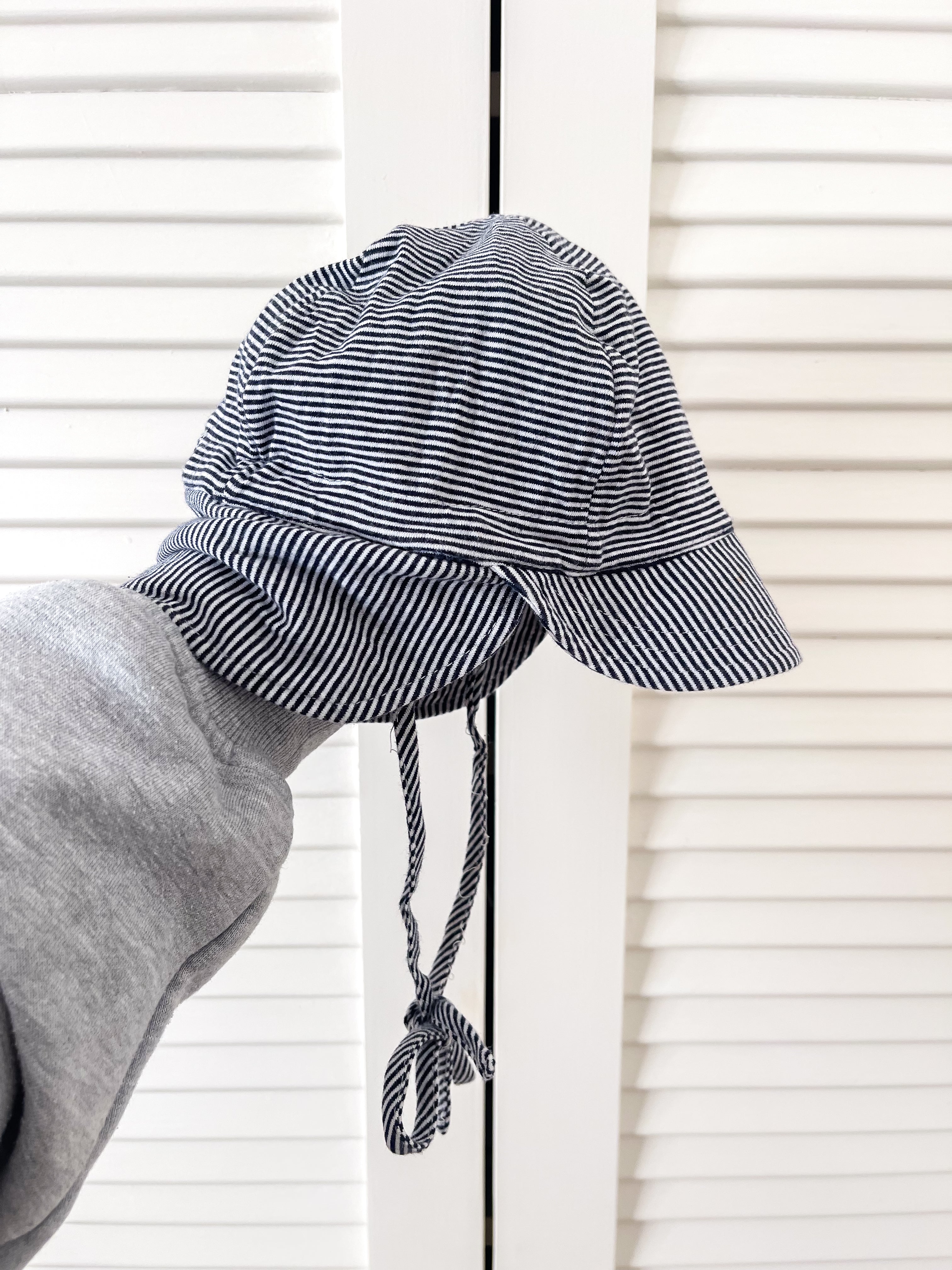 Toshi flap cap (8-24m)
