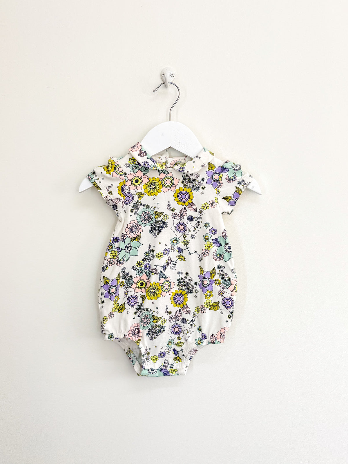 Milky floral collared bubblesuit (6-12m)