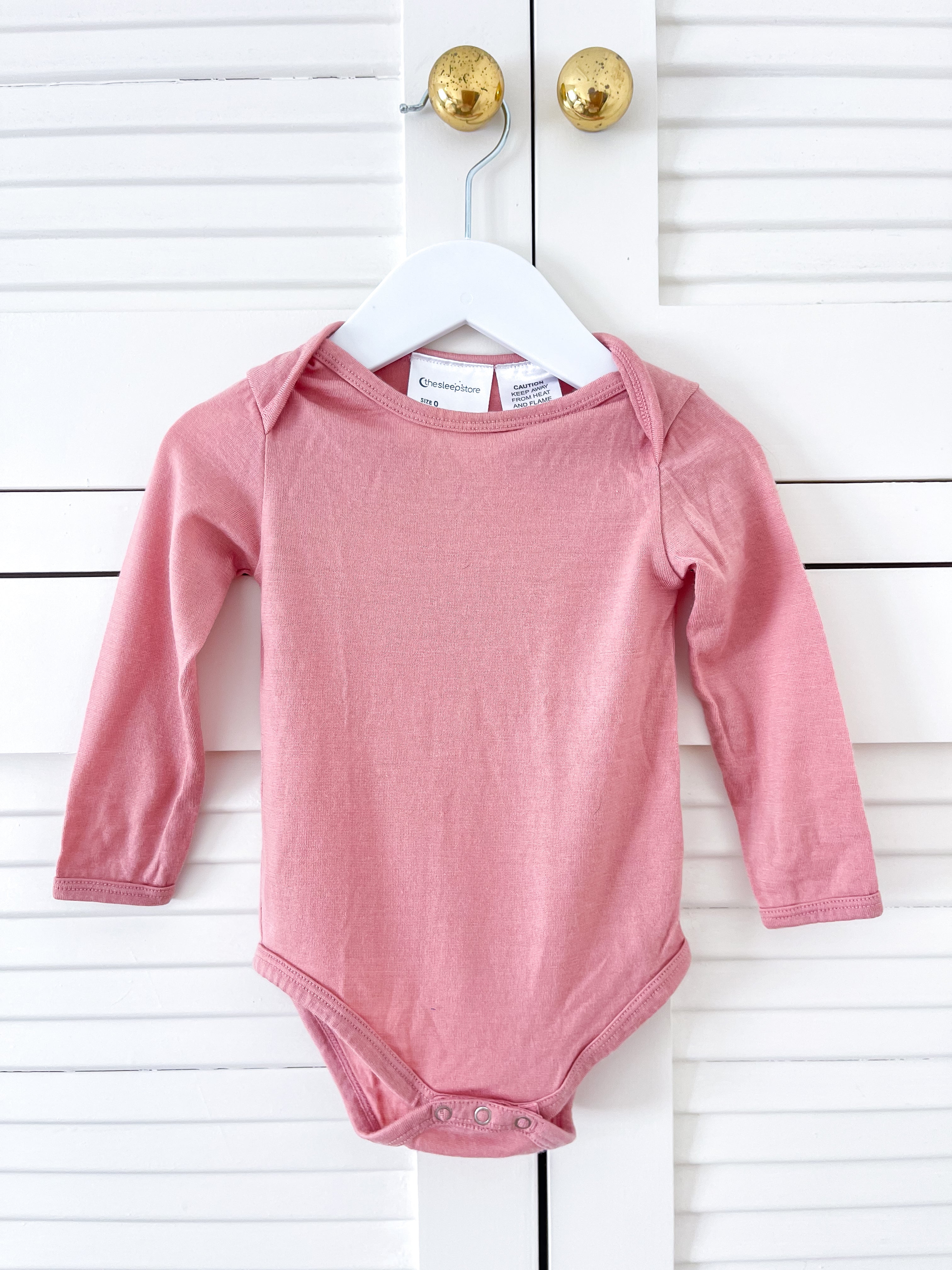 The Sleep Store merino bodysuit - pink (3-6m)