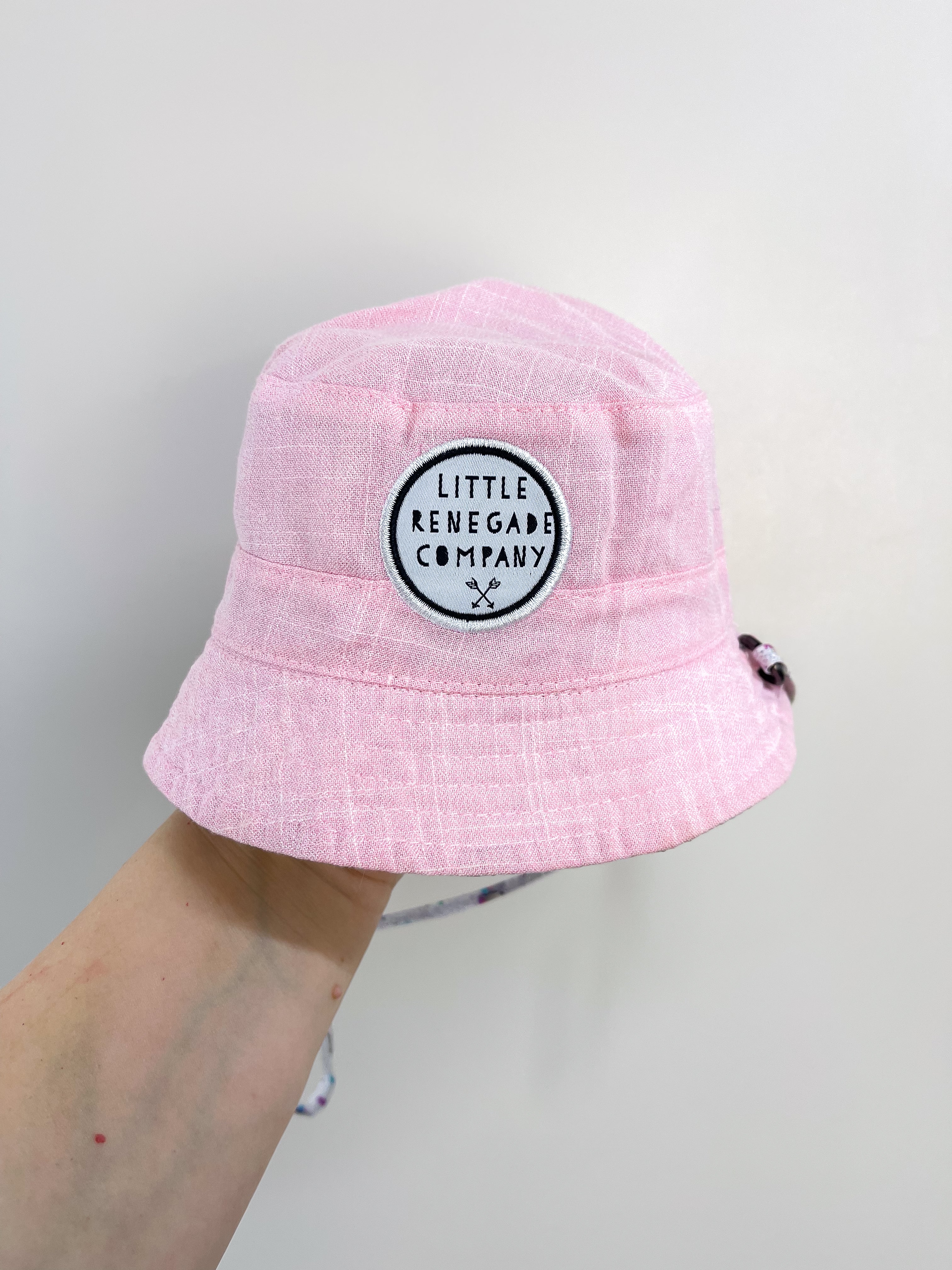 Little Renegade reversible hat - unicorns (0-1y)