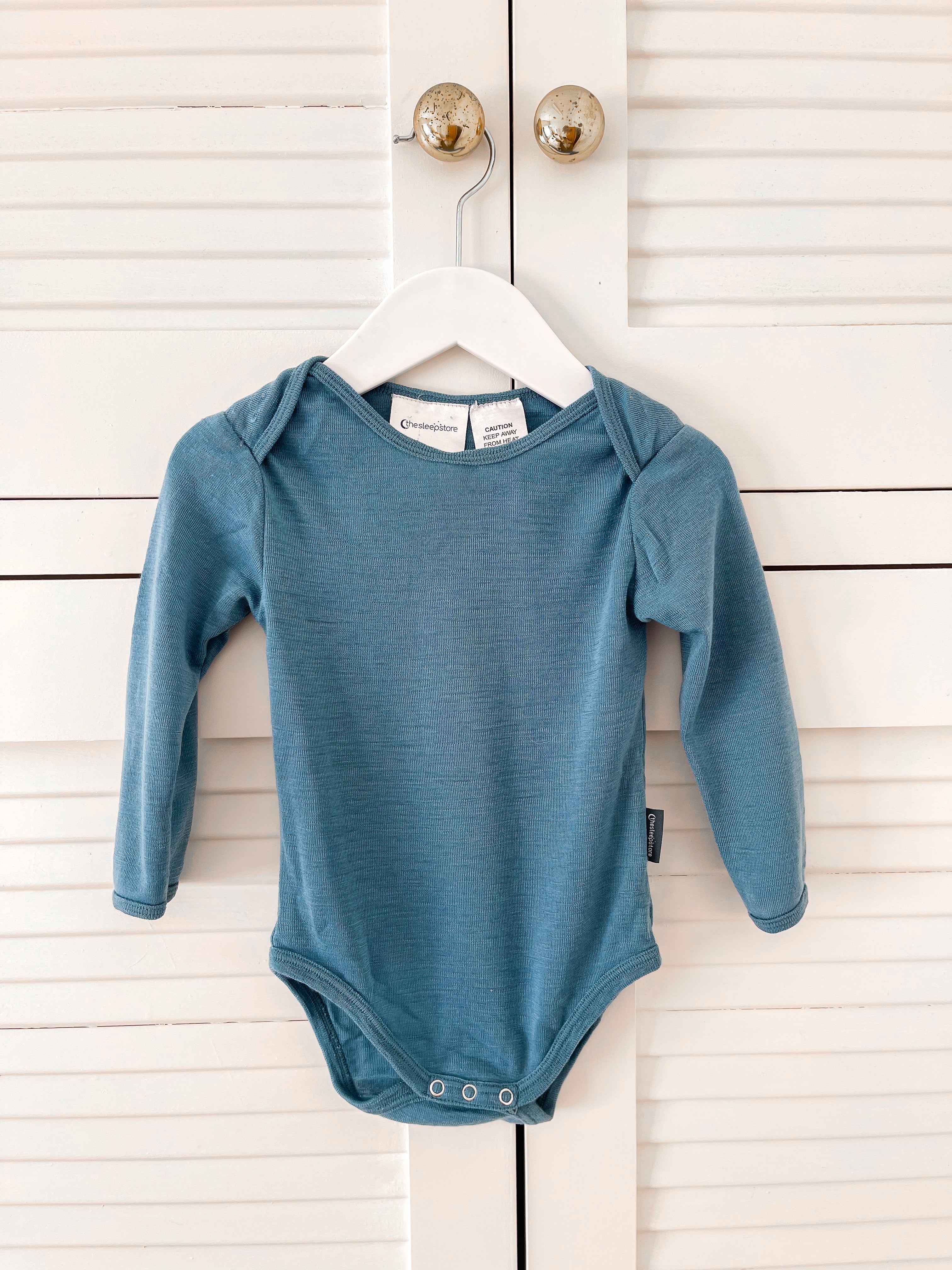 The Sleep Store merino bodysuit - teal (0-3m)